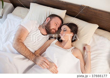 married couple sleeping in the bedroom 37666177