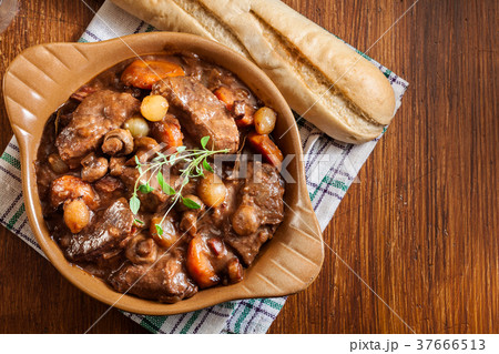 Beef Bourguignon stew served with baguette 37666513