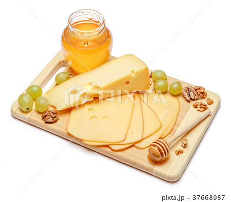 swiss cheese or cheddar and honey on white 37668987