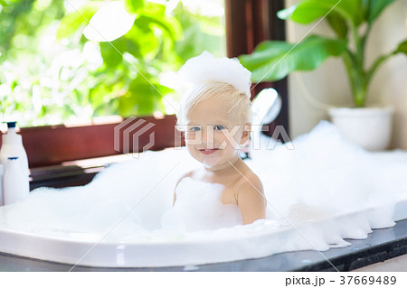 Child in bubble bath. Kid bathing. Baby in shower. Child in bubble bath. Kid bathing. Baby in shower. 37669489
