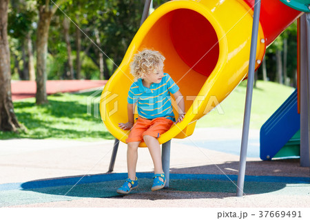 Kids on playground. Children play in summer park. 37669491
