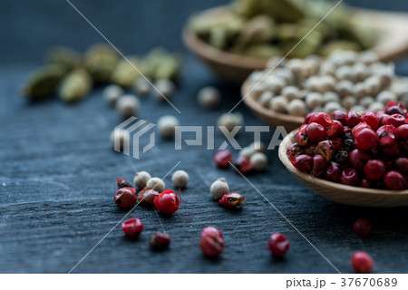 Close up three wooden spoons with colorful spices Close up three wooden spoons with colorful spices 37670689