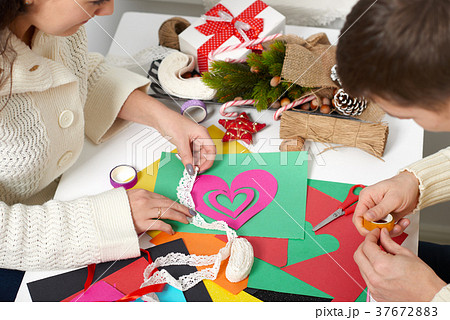 young couple making hearts for Valentine day young couple making hearts for Valentine day 37672883