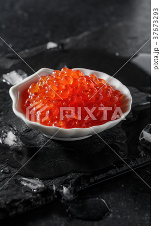 Red caviar in the white bowl in seashell 37673293