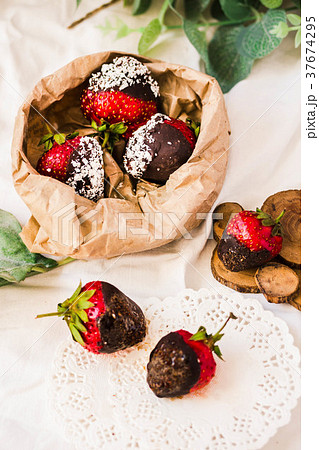 Strawberries dipped in dark chocolate, coconut Strawberries dipped in dark chocolate, coconut 37674295