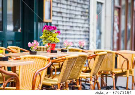 Outdoor cafe on a street of typical greek Outdoor cafe on a street of typical greek 37675164