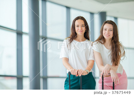 Young tourist women with baggage in international 37675449