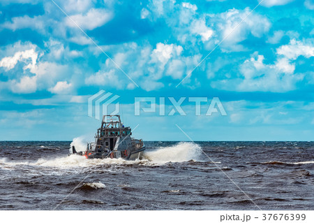 Grey military ship at sea Grey military ship at sea 37676399