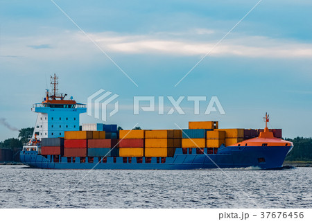 Blue container ship underway Blue container ship underway 37676456