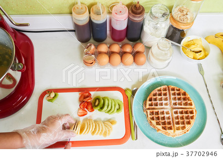 Cutting fresh fruits 37702946