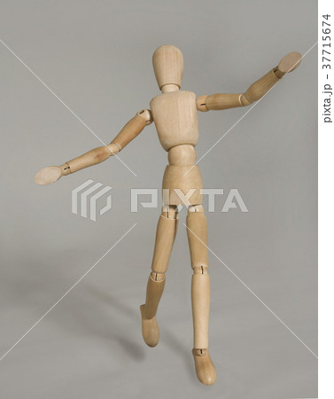 puppet in motion on grey background 37715674
