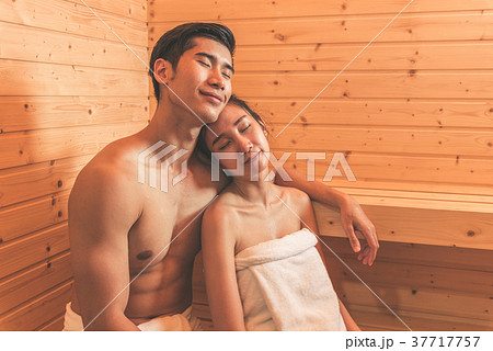 Young Asian couples or lovers have romantic relaxing in sauna ro 37717757