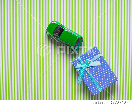 Blue gift box and a toy car 37728122