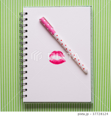 White page with girlish pen and kiss 37728124