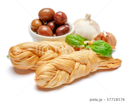 Smoked braided cheese and olives on white Smoked braided cheese and olives on white 37728576