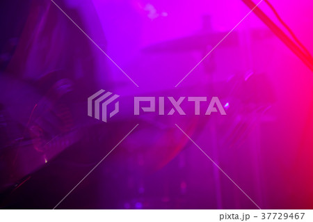 Blurred electric guitar player on a stage Blurred electric guitar player on a stage 37729467
