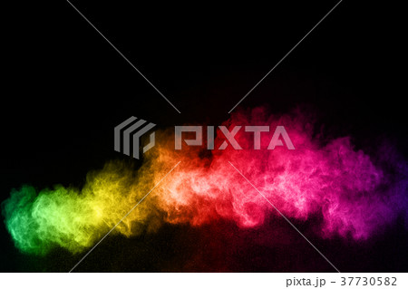 Explosion of colored powder on black background. 37730582