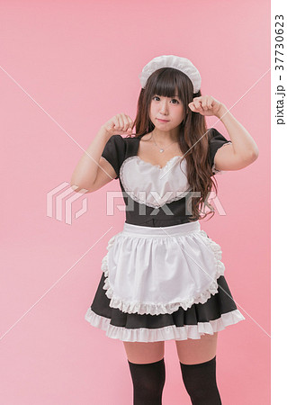 Black Maid Cosplay Cat Pose Stock Photo