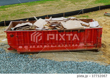Dumpsters being full with garbage 37732067
