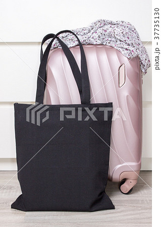 Black cotton eco tote bag with a travel suitcase 37735130