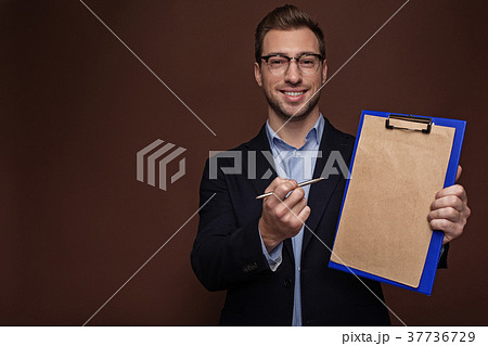 Outgoing man giving clipboard for signature 37736729