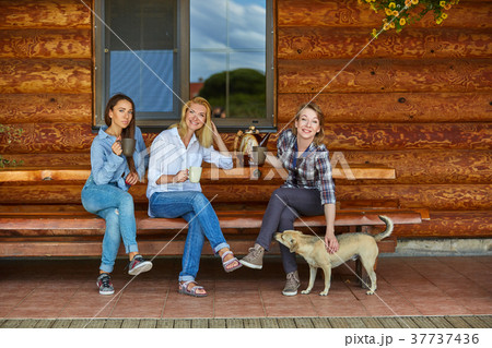 young women drinking tea young women drinking tea 37737436