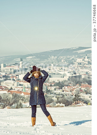 Positive woman posing in snowy landscape, filter Positive woman posing in snowy landscape, filter 37746668
