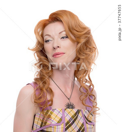 Headshot of a rdhead lady giving a sneer look Headshot of a rdhead lady giving a sneer look 37747655