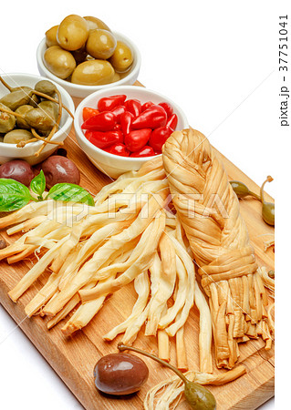 Smoked braided cheese and vegetables on white 37751041