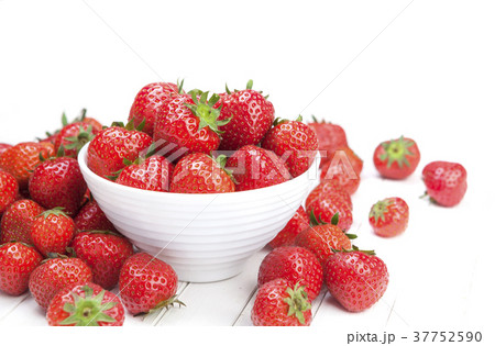 Strawberry in bowl on white table Strawberry in bowl on white table 37752590