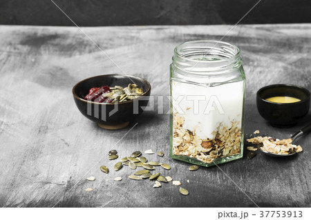 Granola with yogurt, honey, nuts, fruit Granola with yogurt, honey, nuts, fruit 37753913