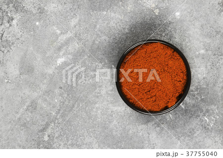 Red hot pepper on a gray background. Top view Red hot pepper on a gray background. Top view 37755040