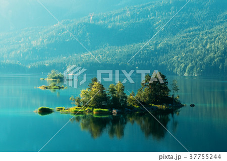 Fantastic sunrise on mountain lake Eibsee Fantastic sunrise on mountain lake Eibsee 37755244