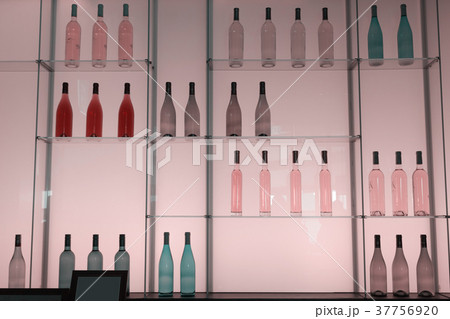 Shelves with bottles of alcohol drinks 37756920