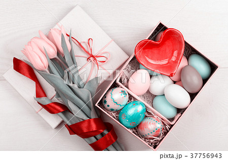 Easter Eggs in a box with colorful yellow tulips 37756943