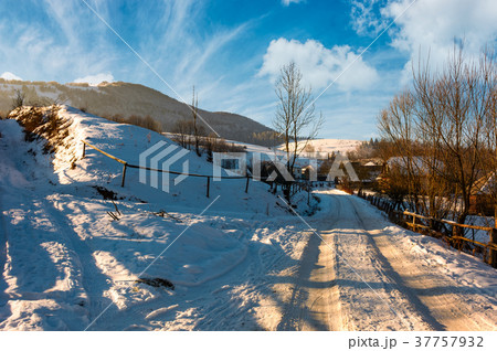 snowy road through the Podobovets village snowy road through the Podobovets village 37757932