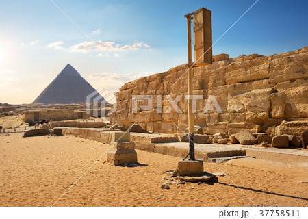 Pyramid and ruins 37758511