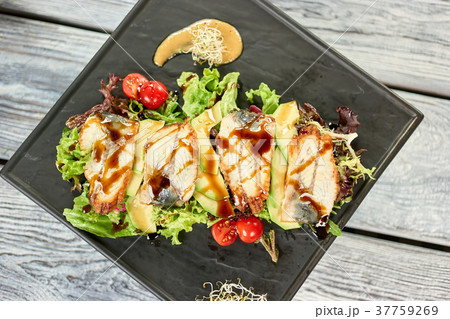 Salad with fish, avocado and sauce. Salad with fish, avocado and sauce. 37759269
