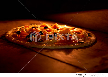 Pizza baking in oven. Pizza baking in oven. 37759920