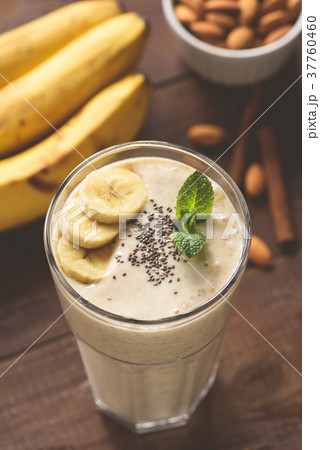 Banana smoothie with chia seeds in glass Banana smoothie with chia seeds in glass 37760460