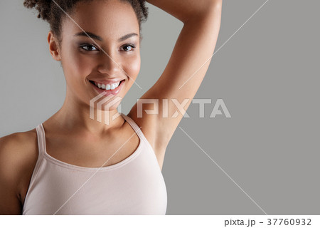 Happy girl demonstrating hairless underarm 37760932