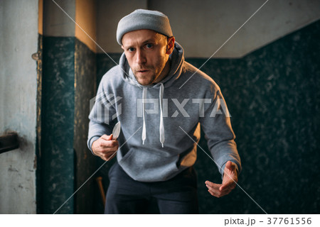 Male robber with knife strikes fear 37761556