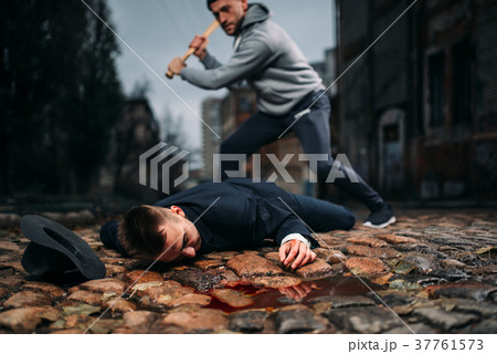 Thief kills his victim with baseball bat Thief kills his victim with baseball bat 37761573