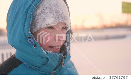 A teenager in winter Park smiling face closeup 37761797