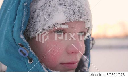 A teenager in winter Park, face closeup . The time A teenager in winter Park, face closeup . The time 37761798