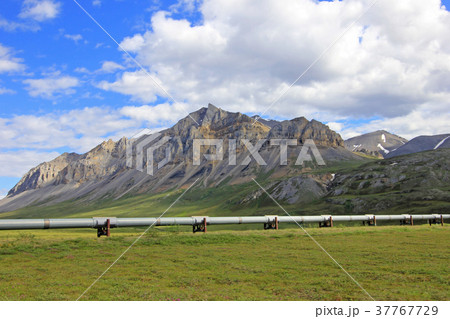 Beautiful mountains with oil pipeline along the Beautiful mountains with oil pipeline along the 37767729