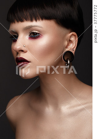 A beautiful girl with art creative make-up and A beautiful girl with art creative make-up and 37775772