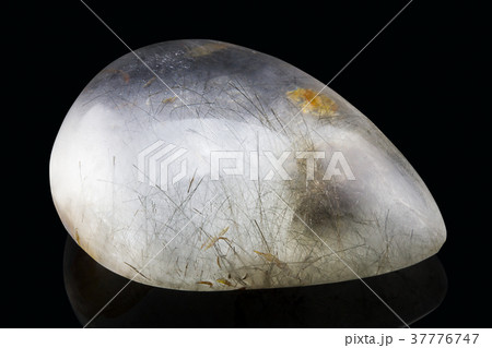 Natural rutile quartz on black background 37776747