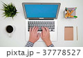 A Man's Hands Typing on the Laptop 37778527
