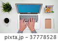 A Man's Hands Typing on the Laptop 37778528